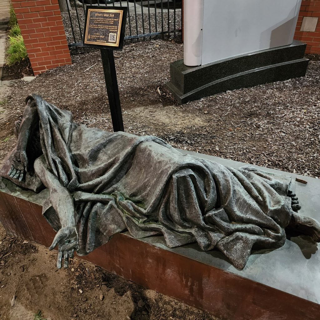 Photo of a statue of a sleeping person.