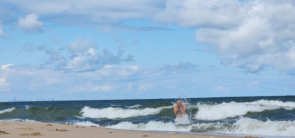 Photo of the author taking a quick dip in Lake Michigan.